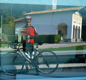 Madonna del Ghisallo reflected in the glass of the Museo del Ciclismo